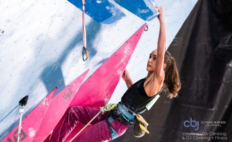 image of annie sanders climbing in competition