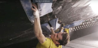 climber climbing a crack indoors