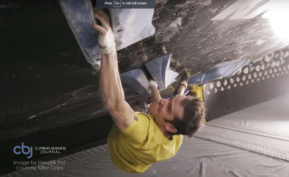 climber climbing a crack indoors