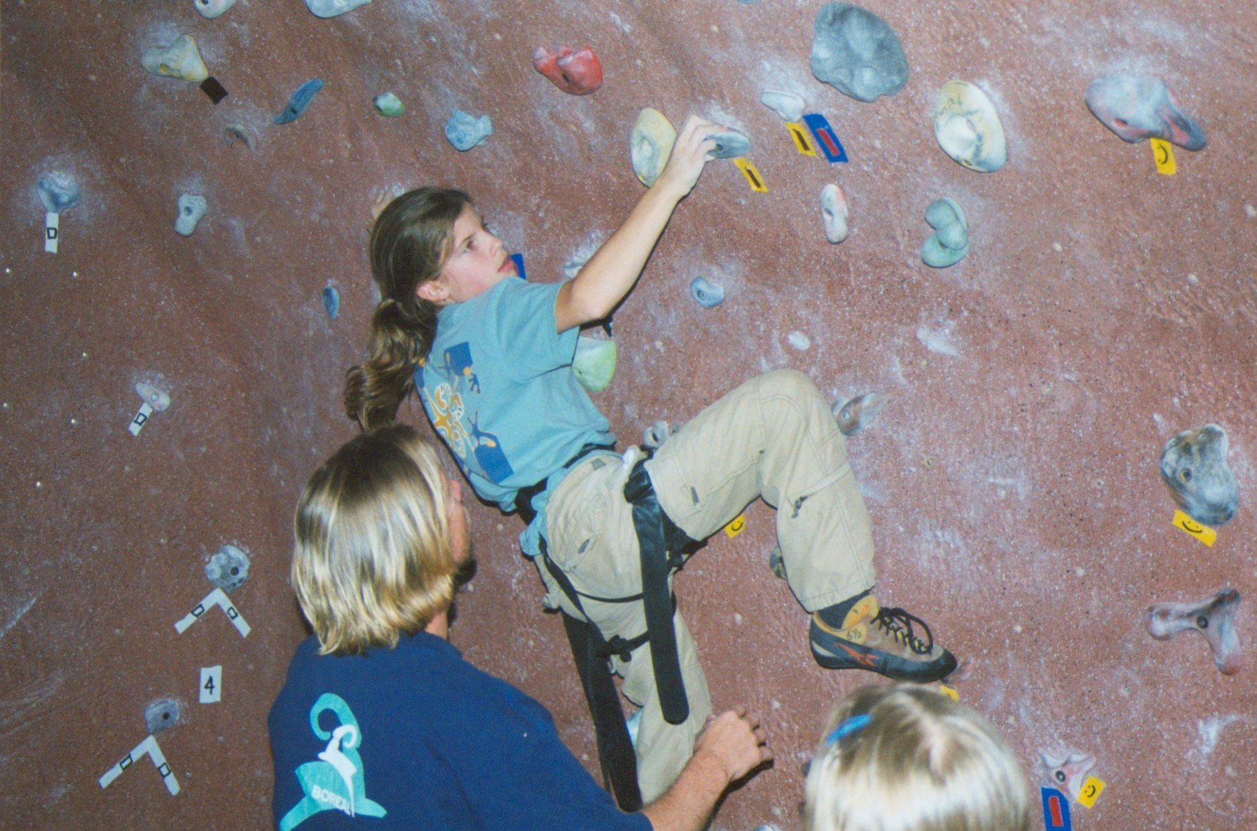A younger Kasia climbing in the gym