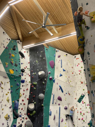 Climbing in a gym with ClimbLab HVLS fans