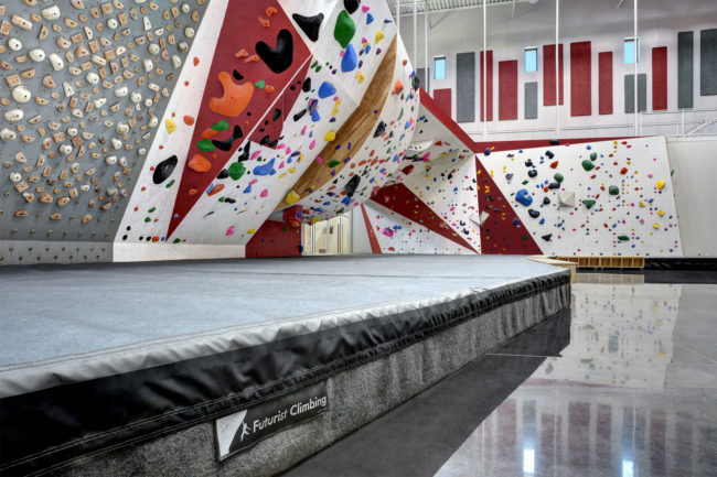 Cost and safety are crucial when choosing a scholastic climbing gym design.